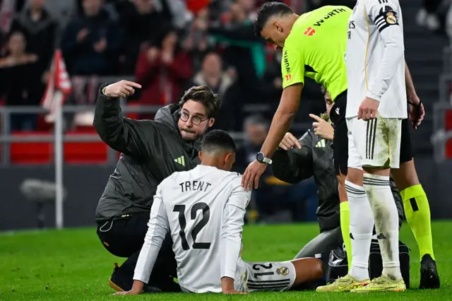 Trent Alexander-Arnold sitting injured on the pitch