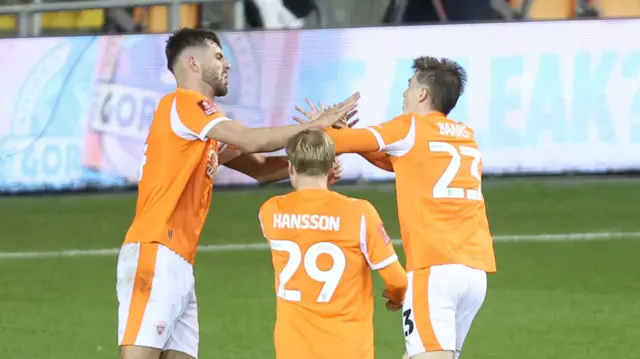 Scott Banks celebrates scoring for Blackpool against Carlisle United