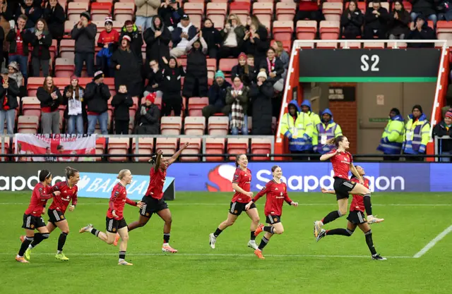 Dominique Janssen of Manchester United celebrates scoring her team's second goal with teammates during the Barclays Women's Super League match between Manchester United and West Ham United at Progress with Unity Stadium on December 07, 2025 in Leigh, England.