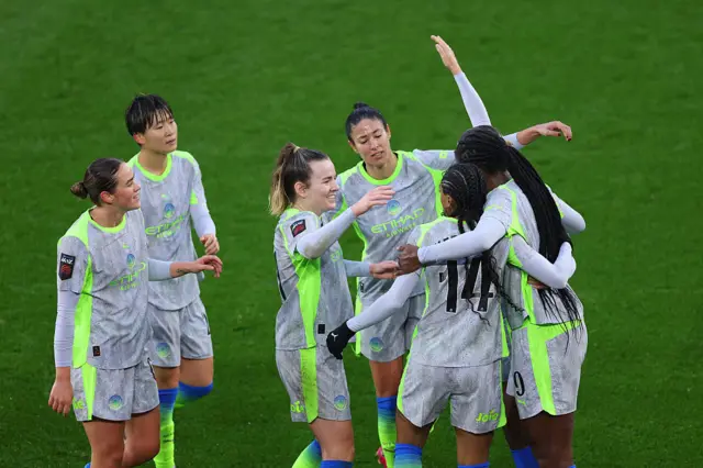 Khadija Shaw of Manchester City (R) celebrates scoring her team's first goal with teammates during the Barclays Women's Super League match between Leicester City and Manchester City at The King Power Stadium on December 07, 2025 in Leicester, England.