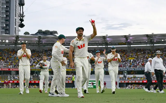 Michael Neser raises the ball at the Gabba