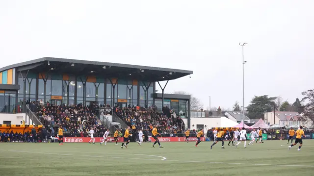 General view of the action during the Emirates FA Cup second round match at Arbour Park, Slough.