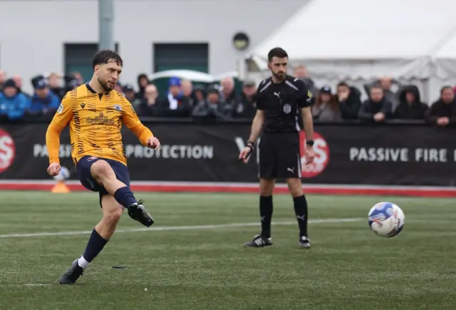 Slough's Wiktor Makowski equalises against Macclesfield from the penalty spot