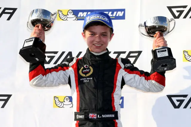 Lando Norris, aged 14, celebrating success in the 2014 Ginetta Junior Championship, where he made his car racing debut