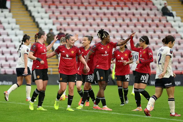 Elisabeth Terland of Manchester United celebrates scoring her team's first goal with her teammates during the Barclays Women's Super League match between Manchester United and West Ham United at Progress with Unity Stadium on December 07, 2025 in Leigh, England.