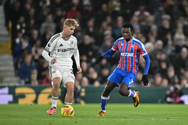 Emile Smith Rowe of Fulham and Eddie Nketiah of Crystal Palace during the Premier League match between Fulham and Crystal Palace at Craven Cottage on December 7, 2025 in London, United Kingdom.