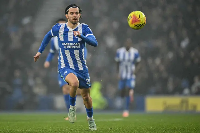 Brighton's Turkish defender #24 Ferdi Kadioglu eyes the ball during the English Premier League football match between Brighton and Hove Albion and West Ham United at the American Express Community Stadium in Brighton, southern England on December 7, 2025.