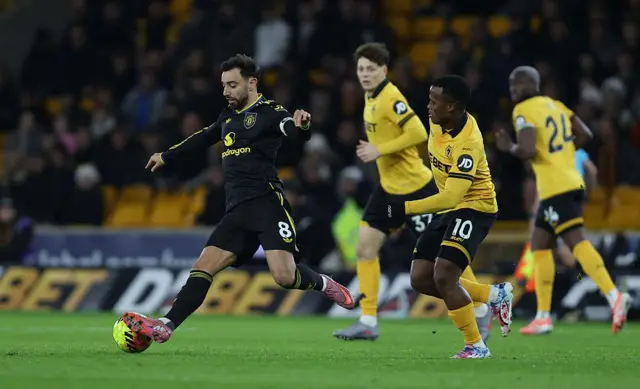 Bruno Fernandes of Manchester United battles for the ball with Jhon Arias of Wolverhampton Wanderers during the Premier League match between Wolverhampton Wanderers and Manchester United at Molineux on December 8, 2025