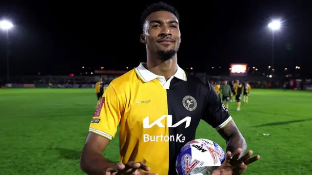 Burton's Tyrese Shade with the matchball