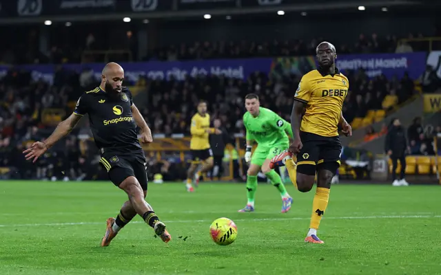 Wolverhampton Wanderers' English goalkeeper #31 Sam Johnston (C) looks opn as Manchester United's Cameroonian midfielder #19 Bryan Mbeumo (L) scores the team's second goal during the English Premier League football match between Wolverhampton Wanderers and Manchester United