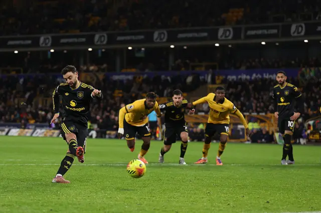 Bruno Fernandes of Manchester United scores their fourth goal with a penalty during the Premier League match between Wolverhampton Wanderers and Manchester United at Molineux on December 08, 2025 in Wolverhampton, England.