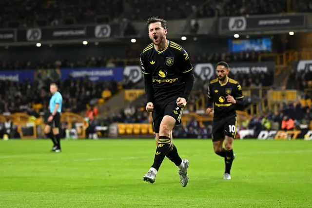 Mason Mount of Manchester United celebrates scoring his team's third goal during the Premier League match between Wolverhampton Wanderers and Manchester United at Molineux on December 08, 2025 in Wolverhampton, England.