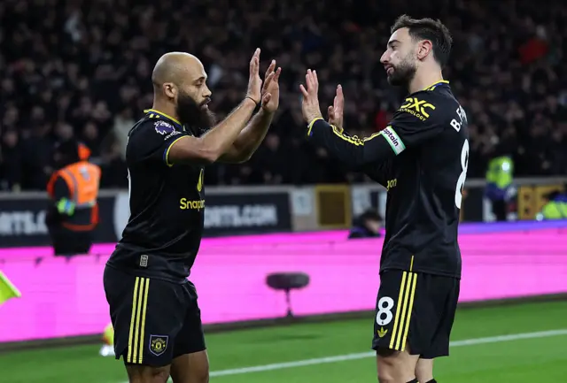 Manchester United's Cameroonian midfielder #19 Bryan Mbeumo (L) celebrates scoring the team's second goal with Manchester United's Portuguese midfielder #08 Bruno Fernandes