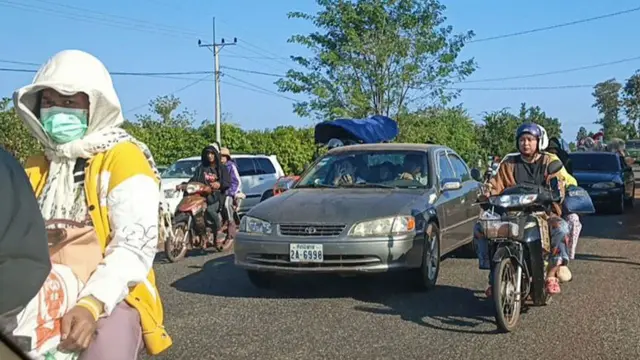 Local residents evacuate following clashes along the Cambodia-Thailand border in Preah Vihear province on December 8, 2025