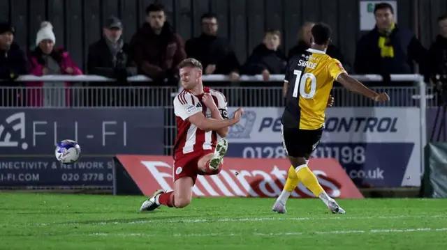 Tyrese Shade scores Burton's third goal at Brackley