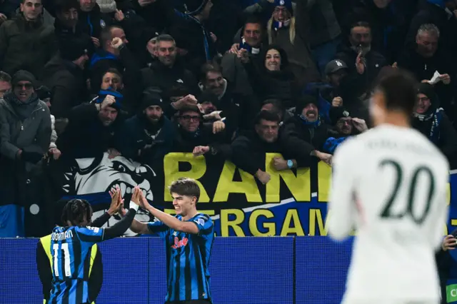 Charles De Ketelaere of Atalanta celebrates with Ademola Lookman and fans