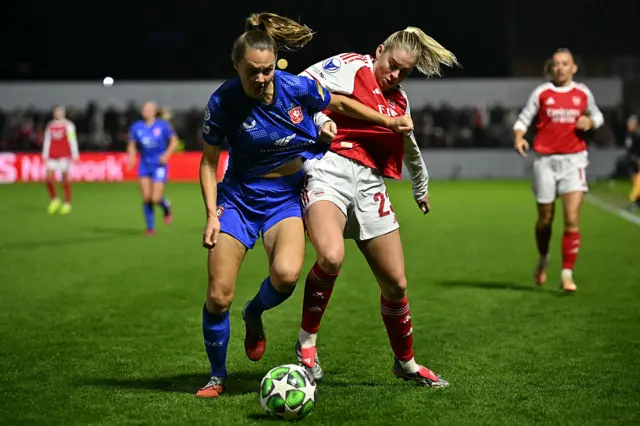 FC Twente's Dutch defender #05 Anna Knol (L) vies with Arsenal's English striker #23 Alessia Russo (R) during the UEFA Women's Champions League, league phase football match between Arsenal and FC Twente at Meadow Park, in Borehamwood,