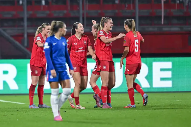 Twente players celebrate a goal v Chelsea