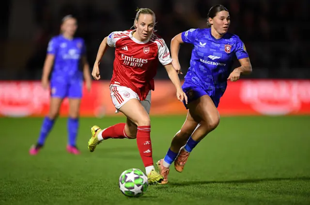 Beth Mead of Arsenal gets past Lynn Groenewegen of FC Twente during the UEFA Women's Champions League 2025/26 league phase match between Arsenal FC and FC Twente at Meadow Park on December 09, 2025 in Borehamwood, England.