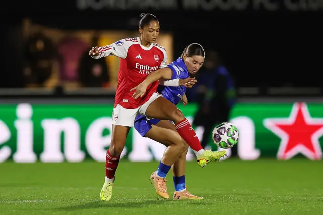 Taylor Hinds of Arsenal battles for possession with Lynn Groenewegen of FC Twente during the UEFA Women's Champions League 2025/26 league phase match between Arsenal FC and FC Twente at Meadow Park on December 09, 2025 in Borehamwood, England.
