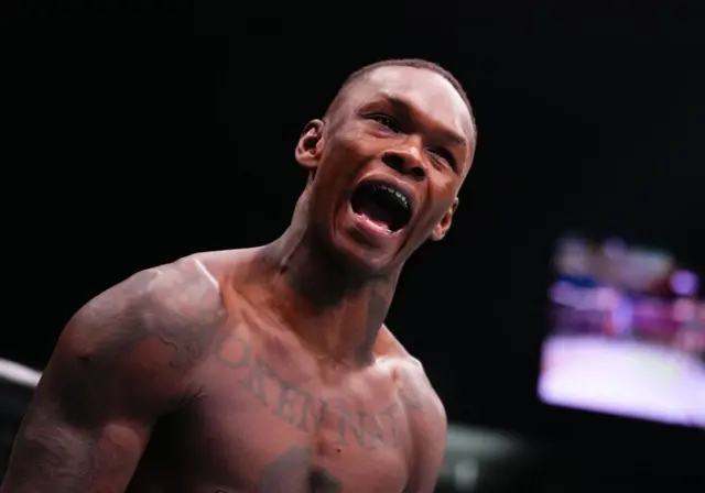 Israel Adesanya shouts before a fight