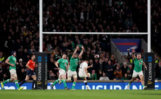 Marcus Smith kicks a drop goal against Ireland