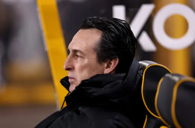 Unai Emery sits in the away dugout