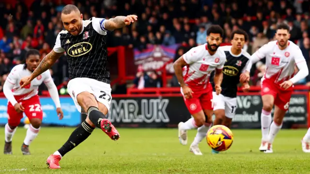 Josh Magennis scores a penalty