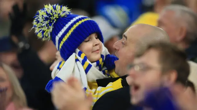 A young Leeds fan celebrates at Elland Road