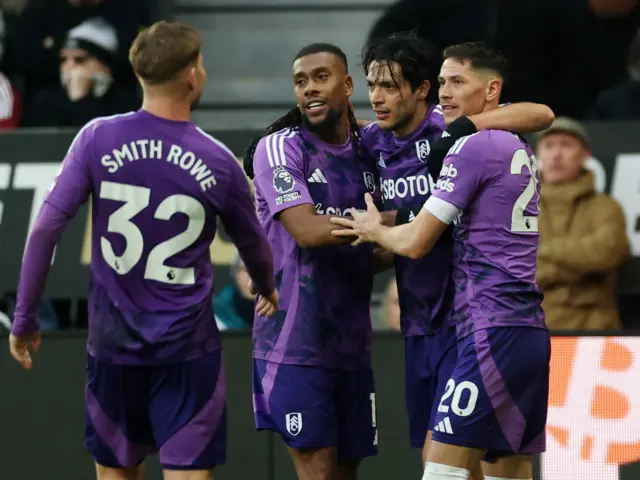 Fulham players celebrate with Jimenez