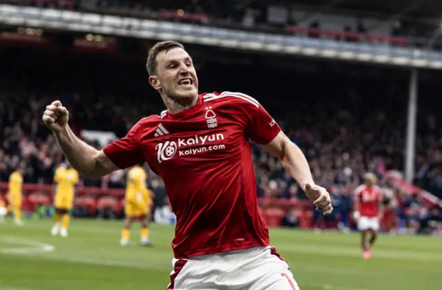 Wood celebrates his hat-trick goal with a fist pump