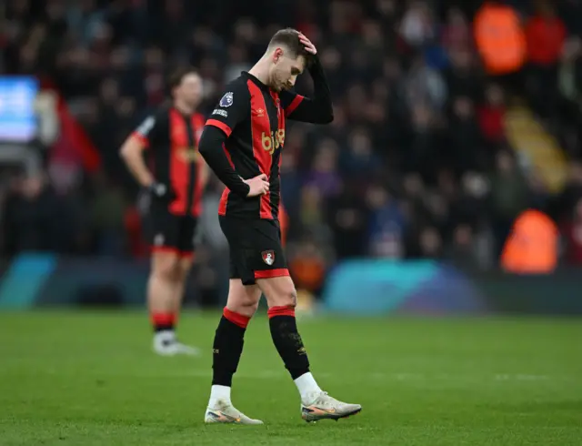 Brooks reacts to his goal being disallowed by putting his hand to his head