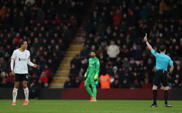 Van dijk is shown a yellow card