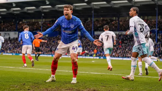 Portsmouth's Callum Lang appeals to the assistant referee