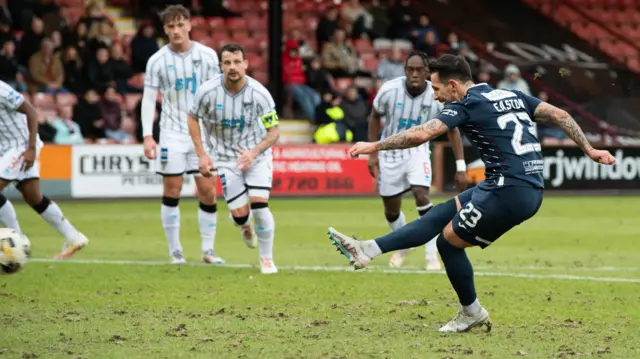 Dylan Easton scores a penalty for Raith Rovers against Dunfermline Athletic