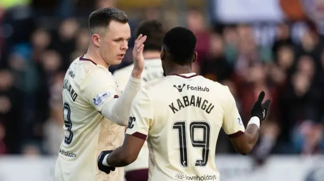 Hearts' Blair Spittal celebrates with Elton Kabangu (R) after Spittal scores to make it 2-0 during a William Hill Premiership match between Dundee and Heart of Midlothian at the Scot Foam Stadium at Dens Park, on February 01, 2025, in Dundee, Scotland. (Photo by Mark Scates / SNS Group)