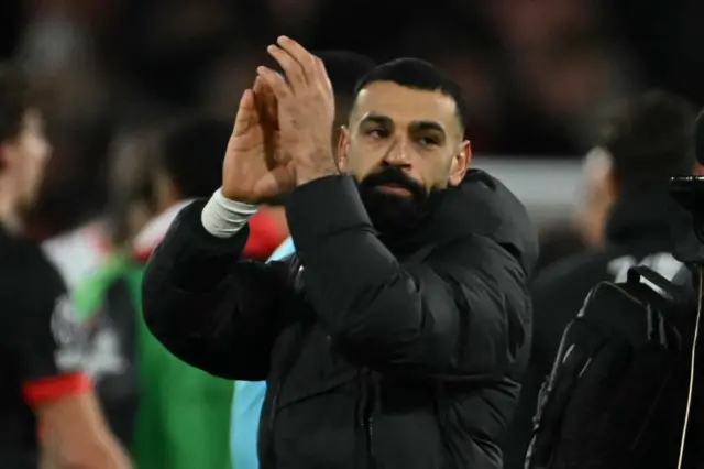 Salah claps the away fans at full time