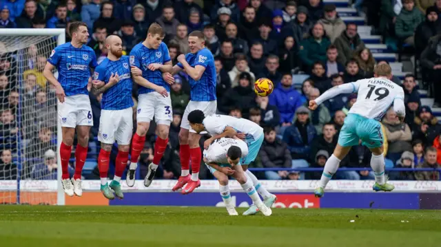 Zian Flemming tries to bend a free-kick around the Portsmouth wall