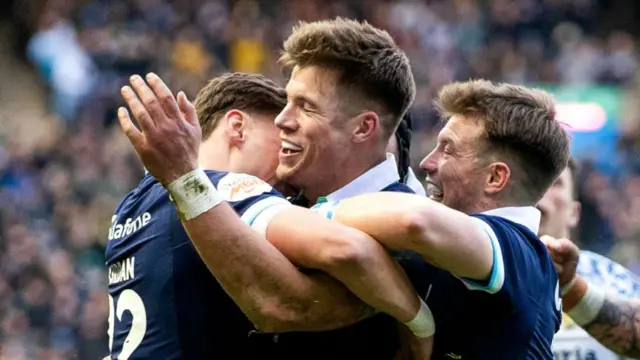 Huw Jones celebrates