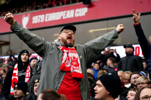 A fan celebrates in the stands