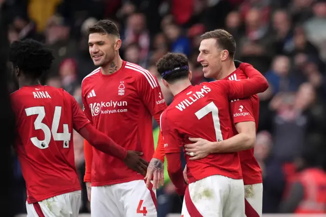 Wood is congratulated by teammates after scoring his third goal