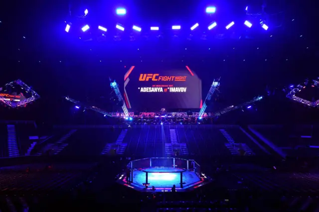 UFC octagon with an advertising board above