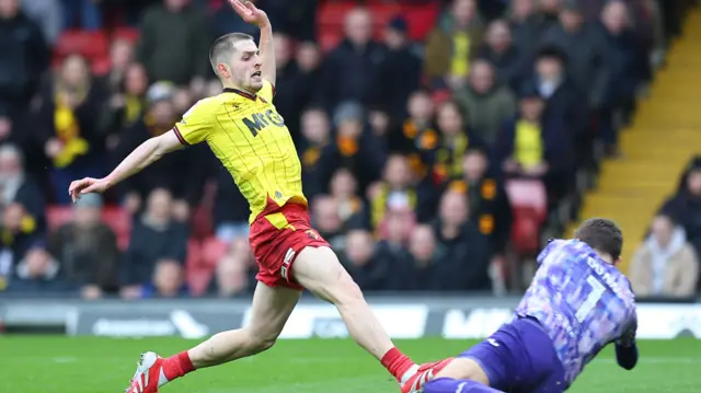 Norwich goalkeeper Angus Gunn saves from Watford's Giorgi Chakvetadze