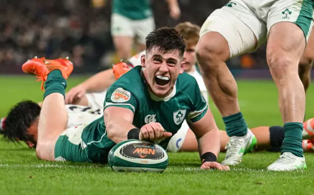 Dan Sheehan scoring a try looking happy