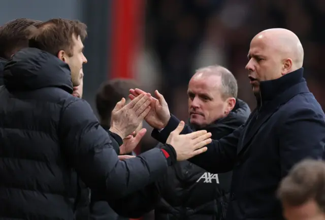 Slot celebrates with his coaching staff