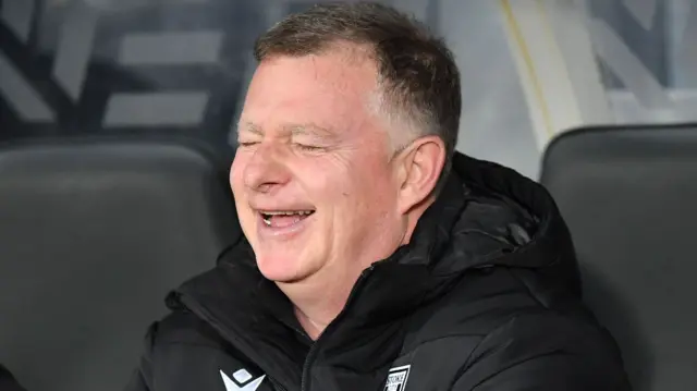 Mark Robins laughs during their win at Hull