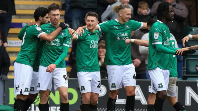 Plymouth players celebrate with Ryan Hardie