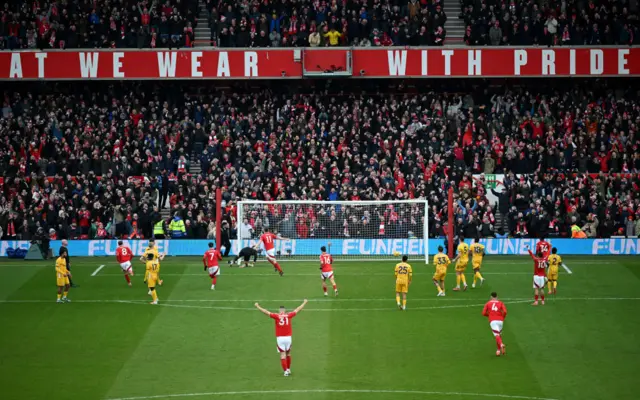 Long angle view of celebrations after Wood's penalty goal