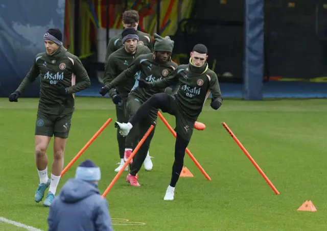 Nico Gonzalez, Phil Foden and Jeremy Doku during training