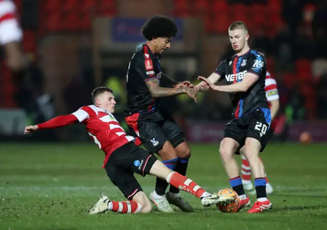 Doncaster Rovers' Robert Street in action with Crystal Palace's Chris Richards and Adam Wharton.